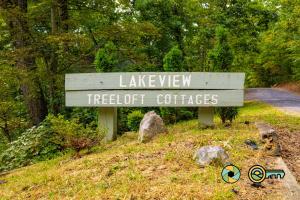 a sign that says lakeview retreats andletcher caches at Lakeview 85B: Treehouse Mountain in Basye