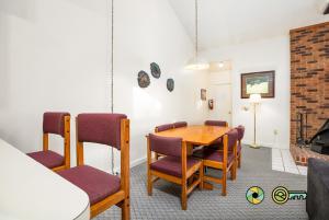a dining room with a table and chairs at Senedo Springs Duplex #98B in Basye +23 photos