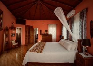 a bedroom with a large bed in a room at I VIEW - in Long Bay in Long Bay Village