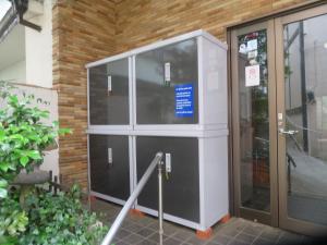 a building with a glass door with a sign on it at Hakone Miyanoshita Myojokan in Hakone