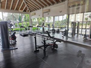a gym with a bunch of treadms and machines at Relax Terrace Condo Near Coronado Beaches in El Creo