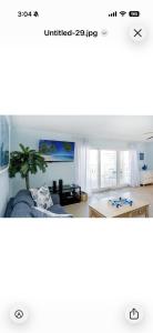 a living room with a couch and a table at Holiday villa 3 in Clearwater Beach