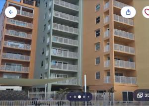 an image of an apartment building with two stickers on it at Holiday villa 3 in Clearwater Beach