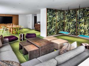a living room with a couch and a table at Fairmont The Queen Elizabeth in Montreal