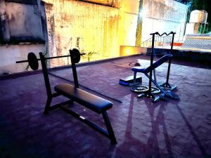 two exercise equipment in a room with a gym at Hostal Punto Americana in Guadalajara