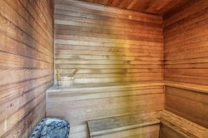 a wooden sauna with a bench in it at Cove Studios in Byron Bay +35 photos