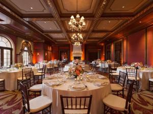 a banquet hall with tables and chairs and a chandelier at Fairmont Grand Del Mar in San Diego +264 photos