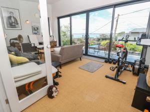 a living room filled with furniture and a large window at Aquanaut in Cowes