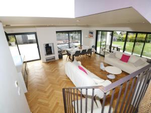 a living room with white furniture and a fireplace at Aquanaut in Cowes