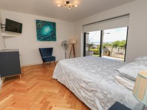 a bedroom with a bed and a large window at Aquanaut in Cowes +45 photos