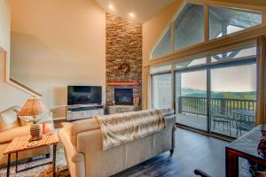 a living room with a couch and a fireplace at Sugar Sky at The Reserve II in Sugar Mountain +51 photos