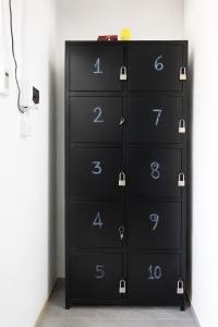 a black dresser with numbers on it in a room at David's Hostel & Restaurant in Kaôh Rŭng (3)