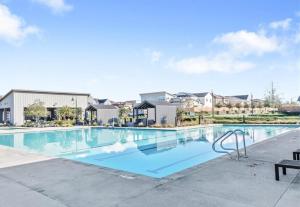 a swimming pool at a apartment complex at Bright and Cozy Bay Window Cottage 6 in Ontario