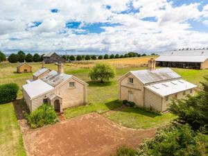 an aerial view of a farm with two barns at Woolmers Estate in Longford