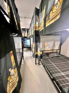 a room with two bunk beds in a store at Hanoi Backpacker Home in Hanoi