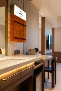 a kitchen with a large sink and a counter at Boutech hotel Banqiao Yellowstone in Taipei +60 photos