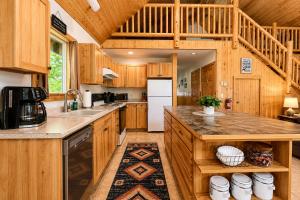 a large kitchen with wooden cabinets and a large island at Pine River Retreat in Leavenworth