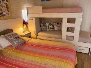 a bedroom with two bunk beds in a room at Apart Los Cerrillos in Balcarce