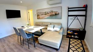 a living room with a table and a couch at Svitanok in Victoria