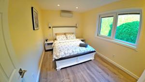 a bedroom with a bed and a window at Svitanok in Victoria