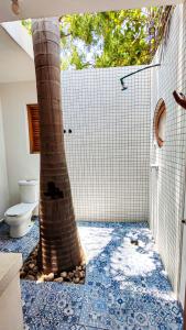 a bathroom with a palm tree painted on the floor at Carpe Diem Casitas & Villas Mazunte in Mazunte +40 photos