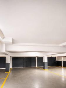 an empty parking garage with a white ceiling at Suite BMB in Abidjan