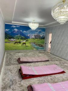 a room with a painting on the wall at Guest House Eltin in Bokonbayevo