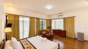 a living room with a bed and a couch at Pondok Senaru Cottages in Senaru