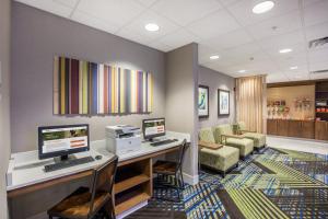 an office with a desk with two computers on it at Holiday Inn Express Hastings by IHG in Hastings