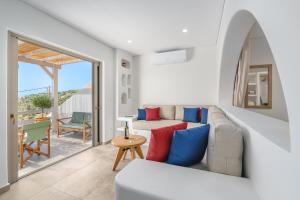 a living room with a couch and a table at Epsilon Apartments in Kalymnos