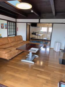 a living room with a couch and a table at Stonehouse2 in Usa