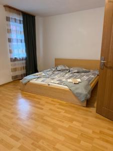 a bedroom with a bed and a wooden floor at Thomas in Judenburg