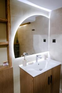 a bathroom with a sink and a mirror at FOS Kastoria in Kastoria +40 photos