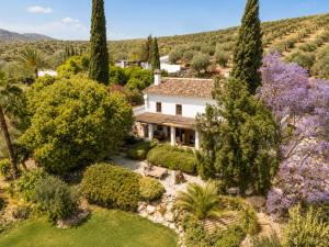 an aerial view of a house with trees and flowers at Finca Dariana Padel & Pool in Alora