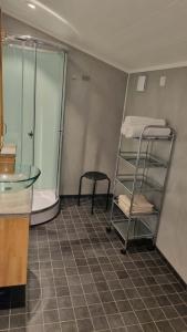 a room with bunk beds and a glass table at Svolvær Minihouse in Kongsmarka +22 photos
