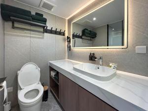a bathroom with a sink and a toilet and a mirror at Vessel 2 - Ukc9442 in Glasgow
