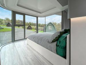 a bedroom with a bed with a view of a barn at Vessel 2 - Ukc9442 in Glasgow
