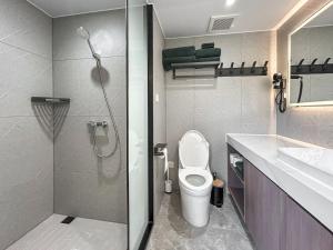 a bathroom with a shower and a toilet and a sink at Vessel 2 - Ukc9442 in Glasgow +4 photos