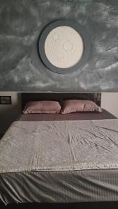 a bedroom with a large bed with a white ceiling at Sri Skandaa in Sringeri
