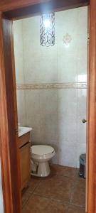 a bathroom with a toilet and a sink at Casa Lagunita in Ensenada +7 photos