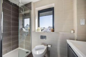 a bathroom with a shower toilet and a sink at Cosy Cottage in Dorchester +33 photos