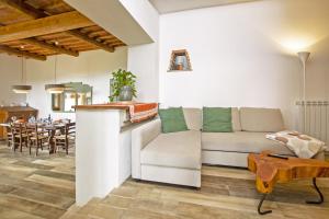 a living room with a couch and a table at Fontesecca - Happy Rentals in Città della Pieve