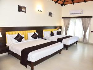two beds in a hotel room with white and black at The Pentouz Hillside Chikmagalur in Chikmagalūr +55 photos