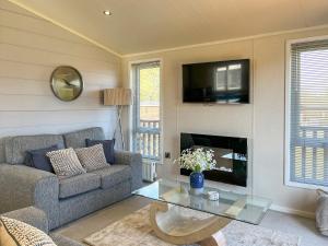 a living room with a couch and a table at The Valerie Jean in Bridlington