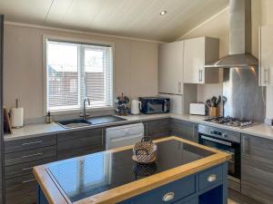 a kitchen with a counter top and a sink at The Valerie Jean in Bridlington +6 photos