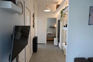 a hallway with a living room and a bedroom at Avra Port House in Porto Heli