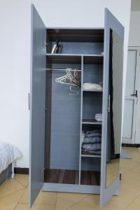 a walk in closet with a door open at The Comfort Den in Kampala