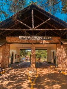 a building with a sign that reads west salarial national preserve at Emaamara camp in Narok