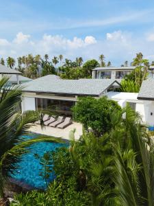 an aerial view of a house with a swimming pool at Twin Villas Natai - North & South Villa - Luxury Beach Front Villa - 6 Br Full Service in Natai Beach