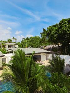 an aerial view of a house with palm trees at Twin Villas Natai - North & South Villa - Luxury Beach Front Villa - 6 Br Full Service in Natai Beach